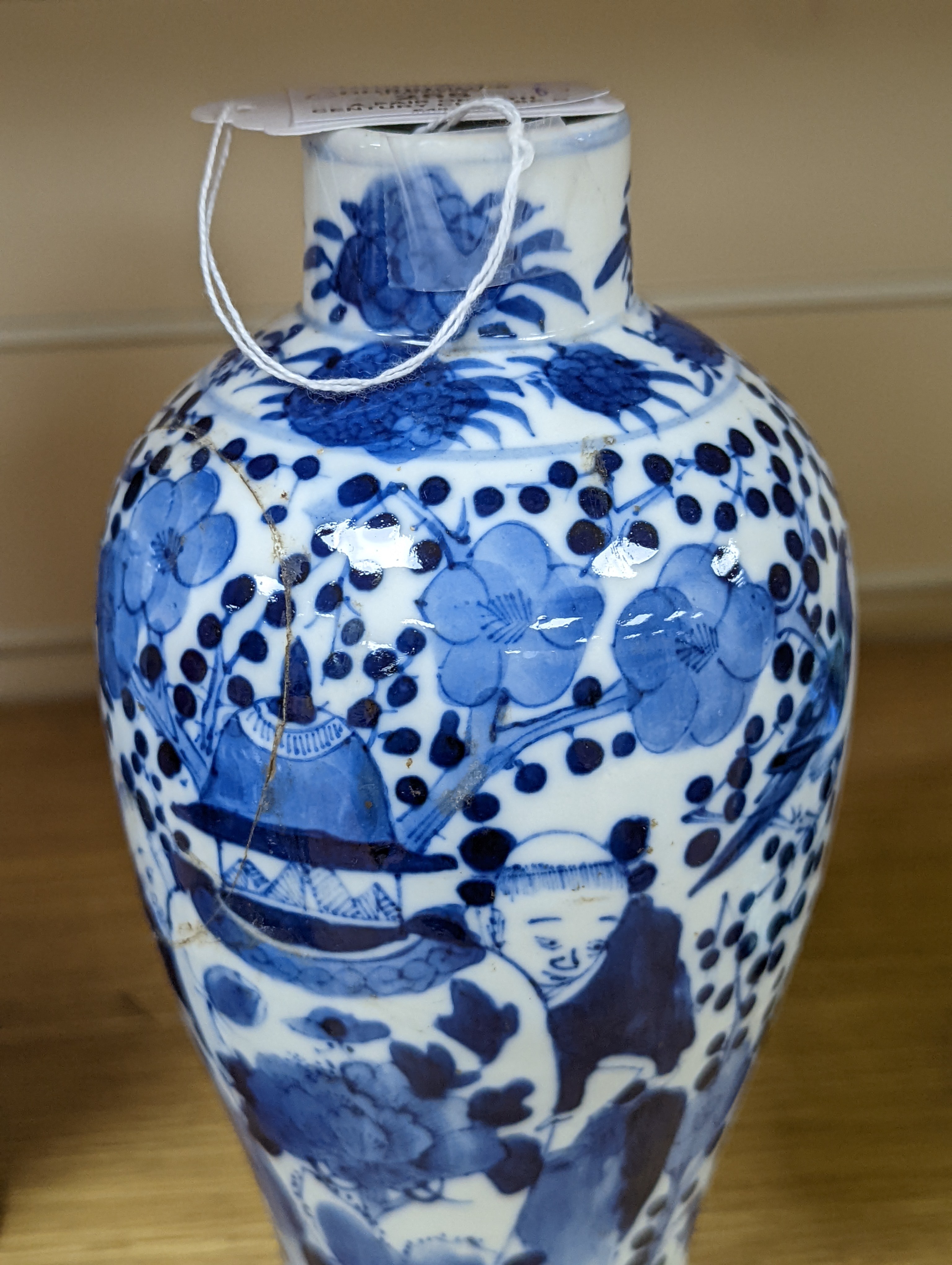 A pair of 19th century Chinese blue and white vases, a prunus vase and cover and a similar jar (4), pair of vases 24 cms high.